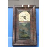 A DECORATIVE HANGING WALL CLOCK WITH KEY