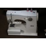 AN ELNA SEWING MACHINE