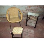 A MIRRORED THREE DRAWER CHEST, A RETRO WICKER CHAIR AND A STOOL