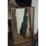 A GILT FRAMED MIRROR, 60 x 95 cm together with two prints