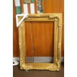 A LARGE GILT FRAME 88 CM X 120 CM