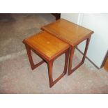 A RETRO TEAK NEST OF TWO TABLES WITH GLASS INSERTS