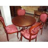 A MODERN ROUND MAHOGANY DINING TABLE AND FOUR BALLOON BACKED CHAIRS