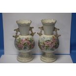 A PAIR OF BELLEEK HAND PAINTED FLORAL TWIN HANDLED VASES WITH BLACK MARKS TO BASE, H APPROXIMATELY
