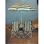 A BOXED FOLDING CHAIR AND PARASOL SET