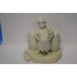 A BELLEEK FIGURE OF AN INNKEEPER WITH TWO LIDDED BARRELS WITH BLACK STAMP TO BASE, H 21 cm