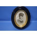 A BELLEEK PORTRAIT PLAQUE OF A VICTORIAN LADY IN A EBONISED FRAME 23 CM X 29 cm
