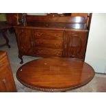 A VINTAGE SIDEBOARD AND A RETRO OVAL COFFEE TABLE