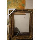 A LARGE GILT FRAME 88 CM X 120 CM