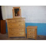 A MODERN OAK FIVE DRAWER, 2 OVER 3 DRAWER CHEST, A THREE DRAWER CHEST BEDSIDE CABINET AND A CHEVAL