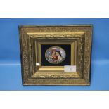 A SMALL FRAMED CERAMIC PLAQUE DEPICTING 2 CLASSICAL STYLE FIGURES 22.5 CM X 20 CM
