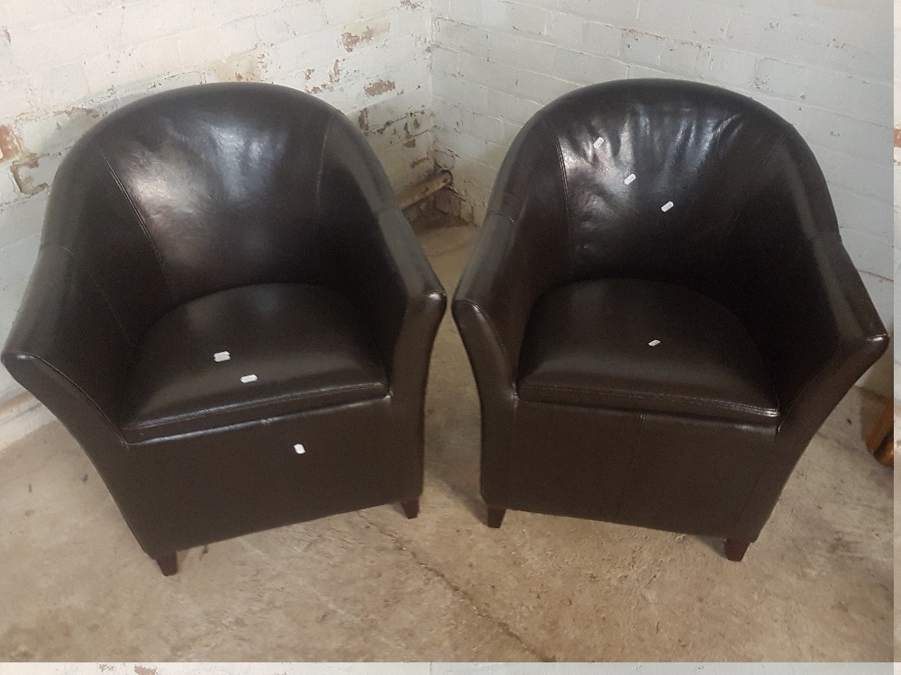 A MATCHING PAIR OF BROWN FAUX LEATHER TUB CHAIRS