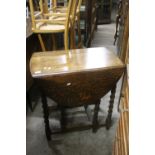 AN ANTIQUE OAK BARLEY TWIST TABLE