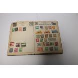 A STAMP ALBUM, STAMPS OF THE WORLD TO INCLUDE CHINESE EXAMPLES