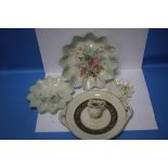 A COLLECTION OF THREE BELLEEK FLORAL PLATES, A BELLEEK TWIN HANDLED PLATE AND A SMALL VASE ALL