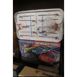 A TABLE TOP ICE HOCKEY GAME TOGETHER WITH A BOXED MICRO SUPER ENDURANCE SCALEXTRIC