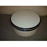 A MODERN ROUND STORAGE COFFEE TABLE