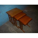 A RETRO STAG TEAK NEST OF THREE TABLES