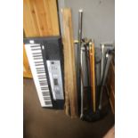 A QUANTITY OF ASSORTED WALKING STICKS ETC AND A KEYBOARD