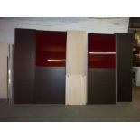 A LARGE FLAT PACK SLIDING DOOR WARDROBE