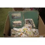 A LARGE QUANTITY OF TEA CARDS, CIGARETTE CARDS, POSTCARDS ETC IN ALBUMS AND LOOSE