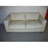 A LEATHER TWO SEATER SOFA