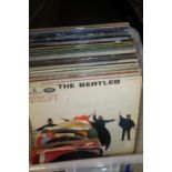 A COLLECTION OF OVER 50 LP RECORDS, TO INCLUDE THE BEATLES "HELP", AND OVER 35 SINGLES AND A FEW