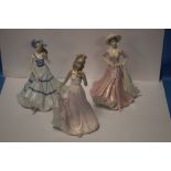 TWO COALPORT FIGURINES "SPECIAL CELEBRATION, AND GOOD LUCK", TOGETHER WITH AN UNNAMED FIGURINE