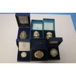 A COLLECTION OF THREE HALCYON DAYS EGGS AND THREE HALCYON DAYS PIN DISHES ALL BOXED