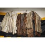 A COLLECTION OF FUR STOLES AND A COAT