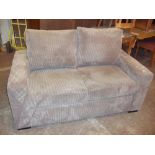 A MODERN JUMBO CHORD TWO SEATER SOFA