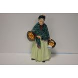 A ROYAL DOULTON FIGURINE "THE ORANGE LADY"