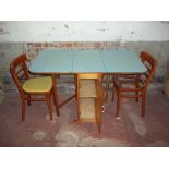 A VINTAGE RETRO FORMICA DROP LEAF KITCHEN TABLE AND TWO CHAIRS WITH STORAGE