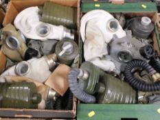 TWO TRAYS OF VINTAGE GAS MASKS AND MILITARIA