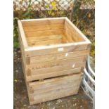 A PAIR OF SQUARE WOODEN PLANTERS