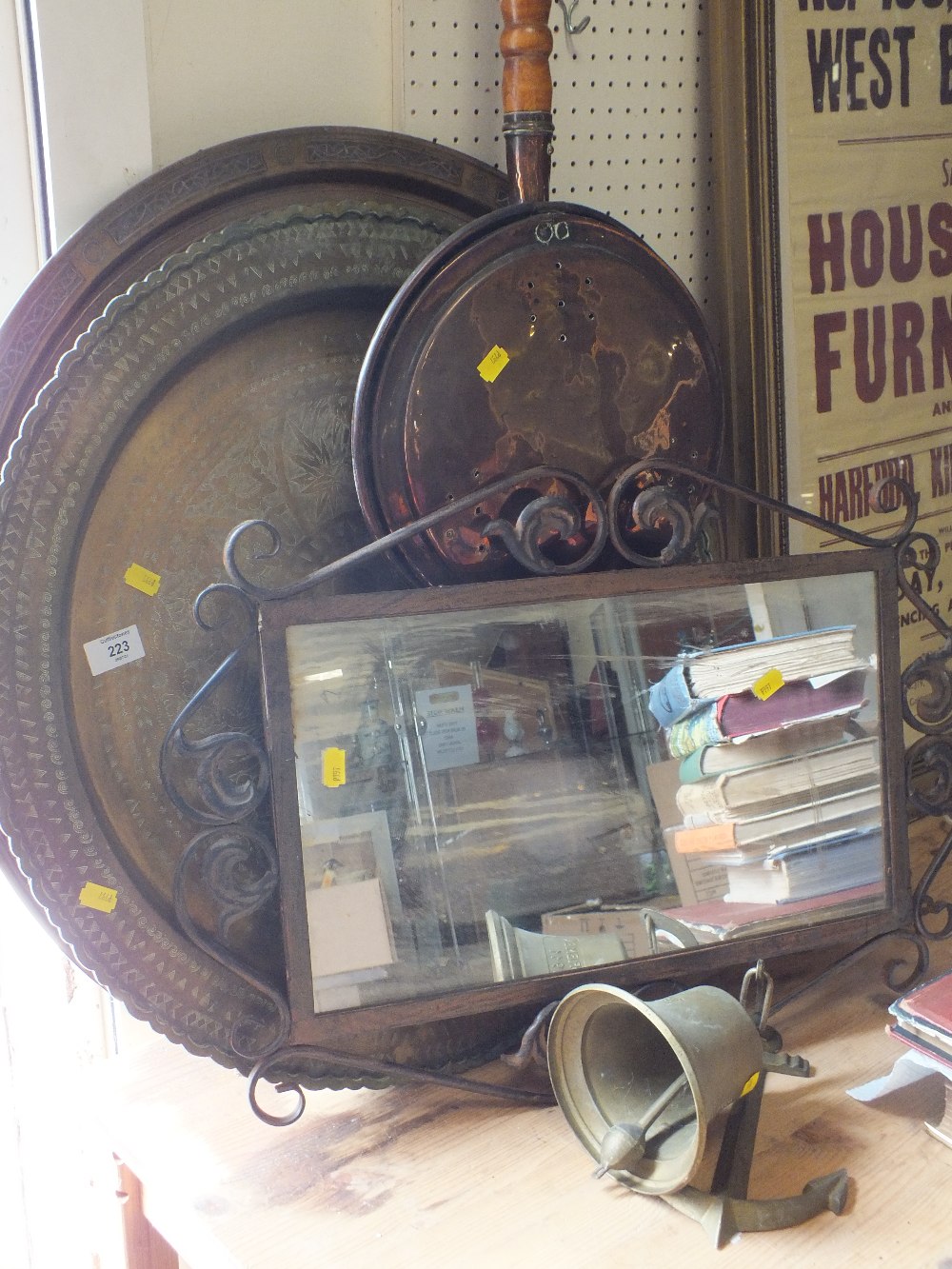 TWO LARGE BRASS CHARGERS, A COPPER WARMING PAN, AN ANCHOR MOUNTED WALL BELL ETC.