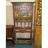 AN ANTIQUE ARTS AND CRAFTS MAHOGANY MIRRORED HALLSTAND H-203 CM W-88 CM A/F