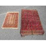 TWO SMALL ANTIQUE EASTERN RUGS LARGEST 157 X 97 CM SMALLEST 98 X 68 CM