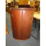 A NINETEENTH CENTURY MAHOGANY HANGING CORNER CUPBOARD