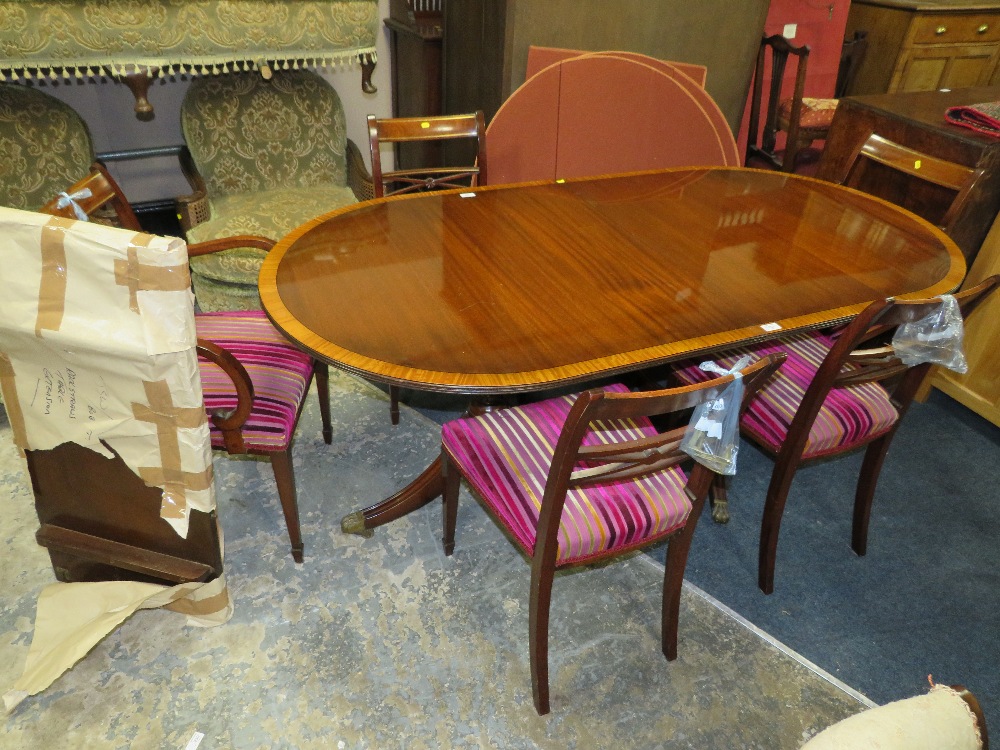 A MODERN TWIN PEDESTAL DINING TABLE WITH ONE SPARE LEAF AND 6 CHAIRS