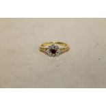 A HALLMARKED 18 CT GOLD RUBY AND DIAMOND RING, APPROX WEIGHT 2.9 G