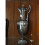 A SILVER PLATED CLARET JUG