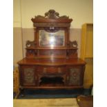 A LARGE ANTIQUE WALNUT MIRRORBACKED SIDEBOARD WITH CARVED CHERUBIC MASK DETAIL H-237 CM W-180 CM