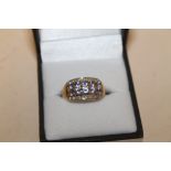 A HALLMARKED 9 CT GOLD TANZANITE STYLE STONE DRESS RING, APPROX WEIGHT 3.5 G