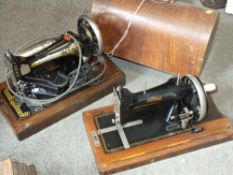 A CASED ELECTRIC SINGER SEWING MACHINE TOGETHER WITH A CASED SPINNEY SEWING MACHINE PLUS A TRAY OF