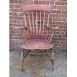 A TRADITIONAL ELM WINDSOR ARMCHAIR