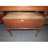 AN ANTIQUE OAK BLANKET BOX RAISED ON A BARLEYTWIST STAND W-94 CM