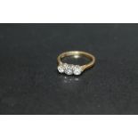 A HALLMARKED 18 CARAT GOLD DIAMOND TRILOGY RING, approx weight 2.8g, ring size N