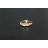 A HALLMARKED 18 CARAT GOLD FIVE STONE DIAMOND RING, approx weight 3g, ring size L