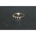 A HALLMARKED 9 CARAT GOLD SEVEN STONE SAPPHIRE AND DIAMOND RING, approx weight 1.7g, ring size V